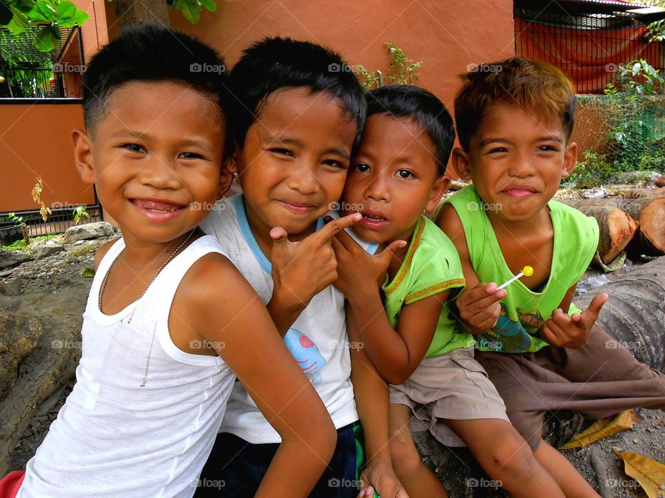 young asian kids smiling at the camera