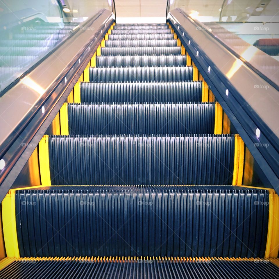 Looking up at an escalator 
