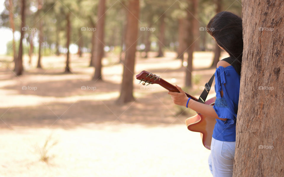Guitar playing girl