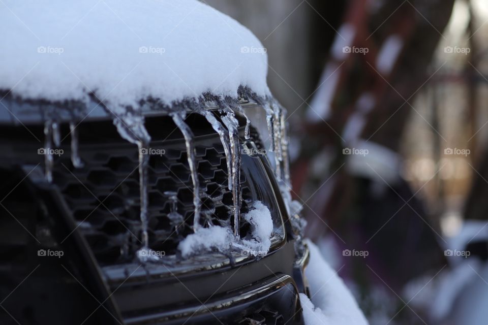 Ice on the front of a car.