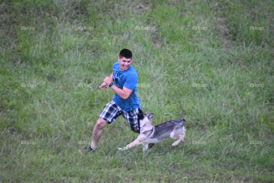 Dog chasing man 
