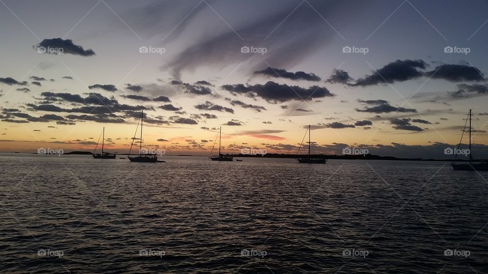 sailboats after sunset
