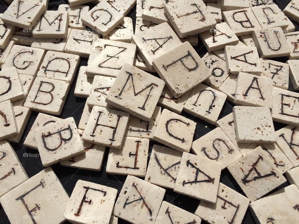 Many carved letters on marble pieces