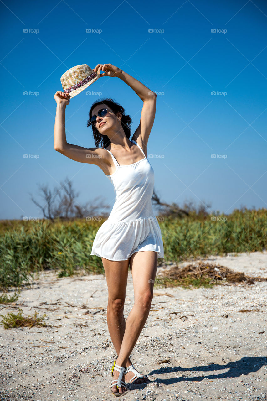 young girl dance on the beach