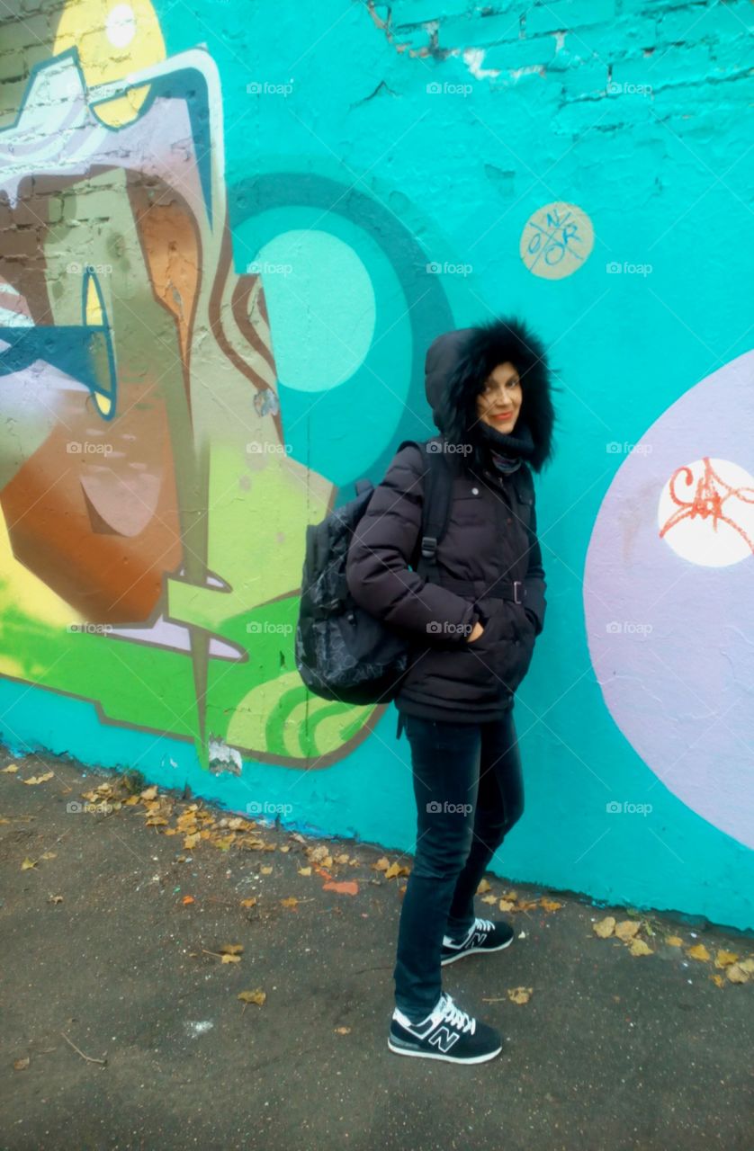 girl on a graffiti wall