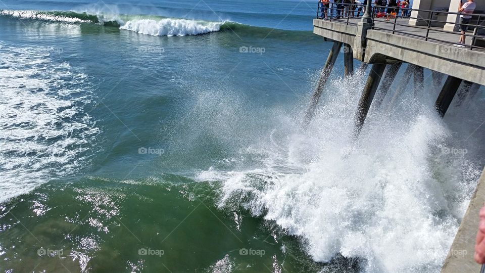 A Storm has waves crashing against the Pier!