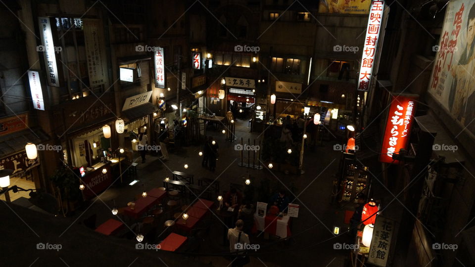 Ramen Museum in Yokohama, Japan.   They covered the basement of an office building to an 1960's esque environment with about a dozen ramen restaurants for visitors to try.