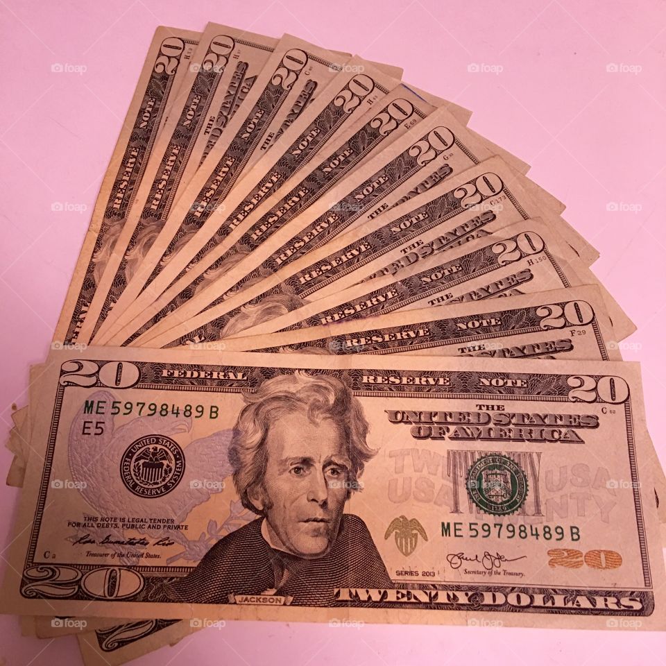 $20 bills U.S. laid out on table,  original light