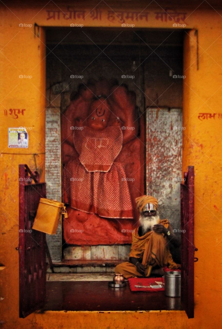 BABA
inside Varanasi 
I was walking around early morning at ghat (river bank) I saw a munk (BABA) .
The BABA seat inside hanuman temple and reading mantras with the holy necklace Rudraksh . As you know Varanasi is famous for BABA and shadhus.