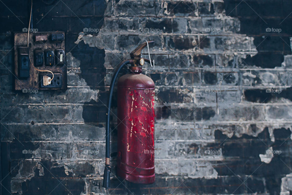 Red Fire Extinguisher And Electrical Panel