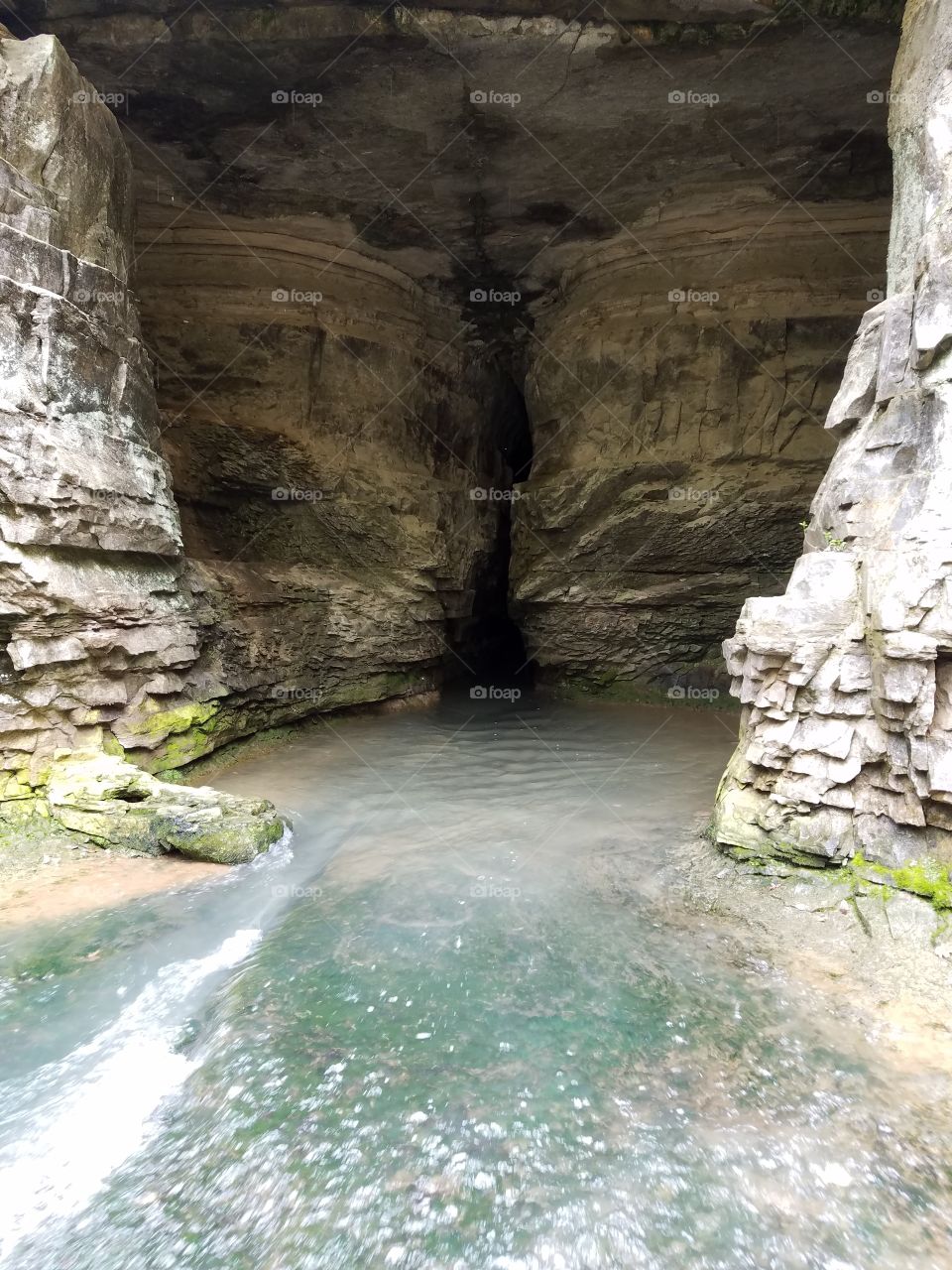 spring flowing out from cave