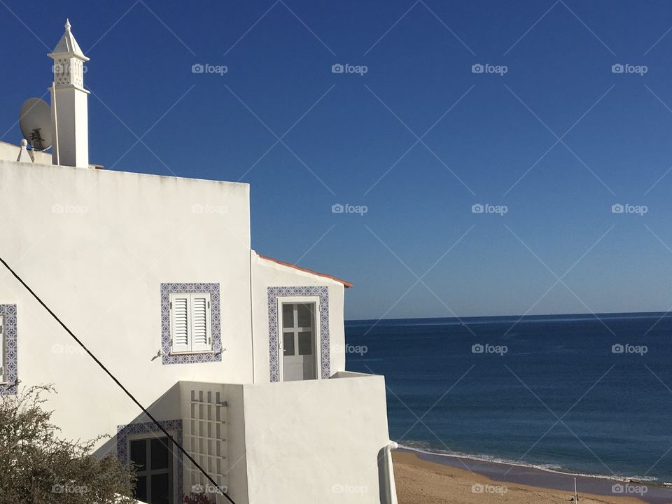 Sunny and typical house with view on seashore 