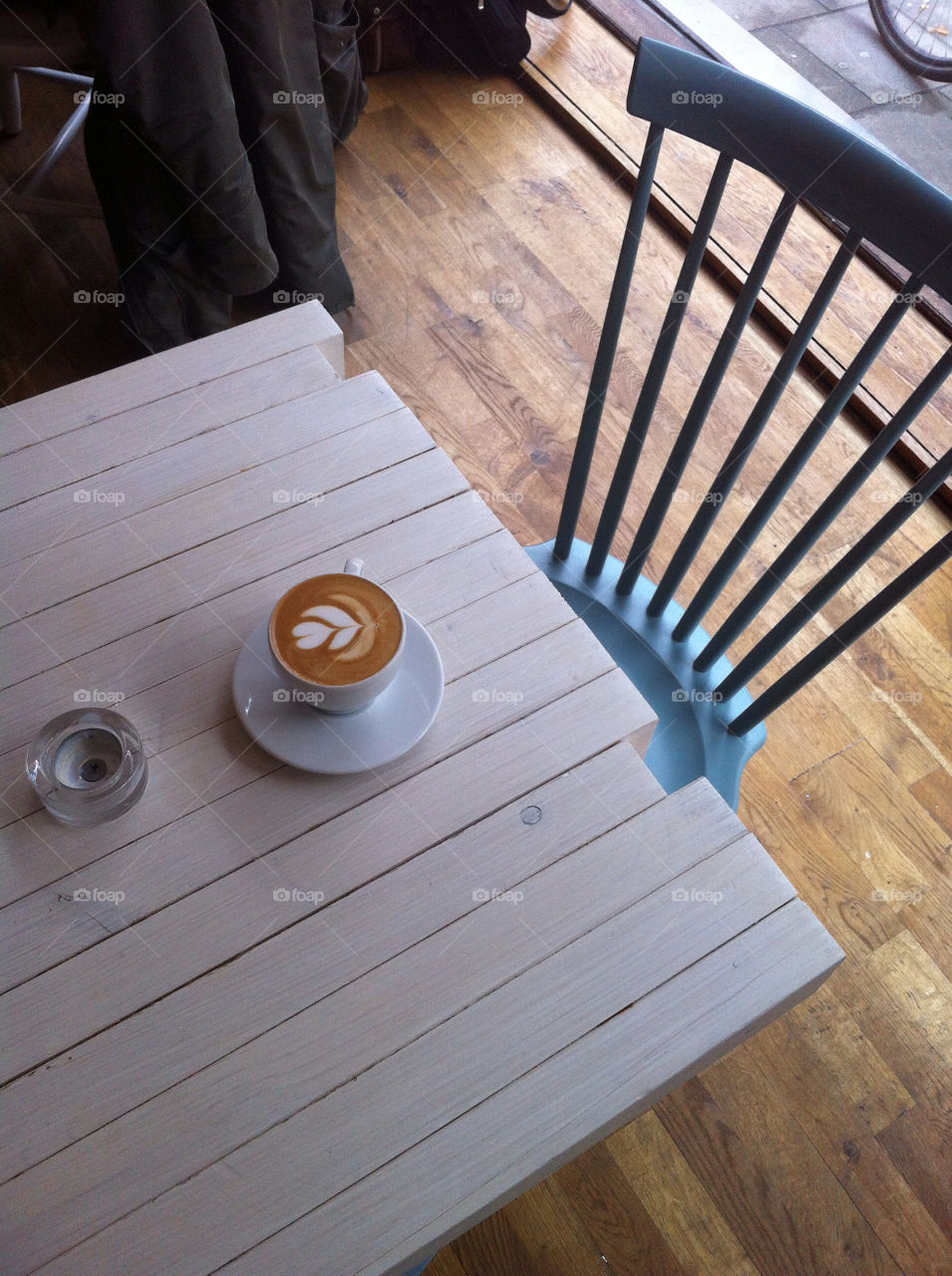 Cappuccino in cafe. A cappuccino on a cafe table
