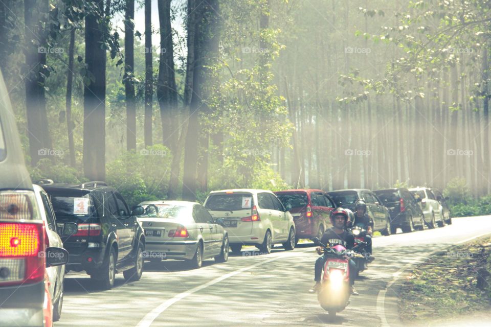 View of cars queuing on the road entering the city of Bandung causing traffic jams, Bandung, Indonesia