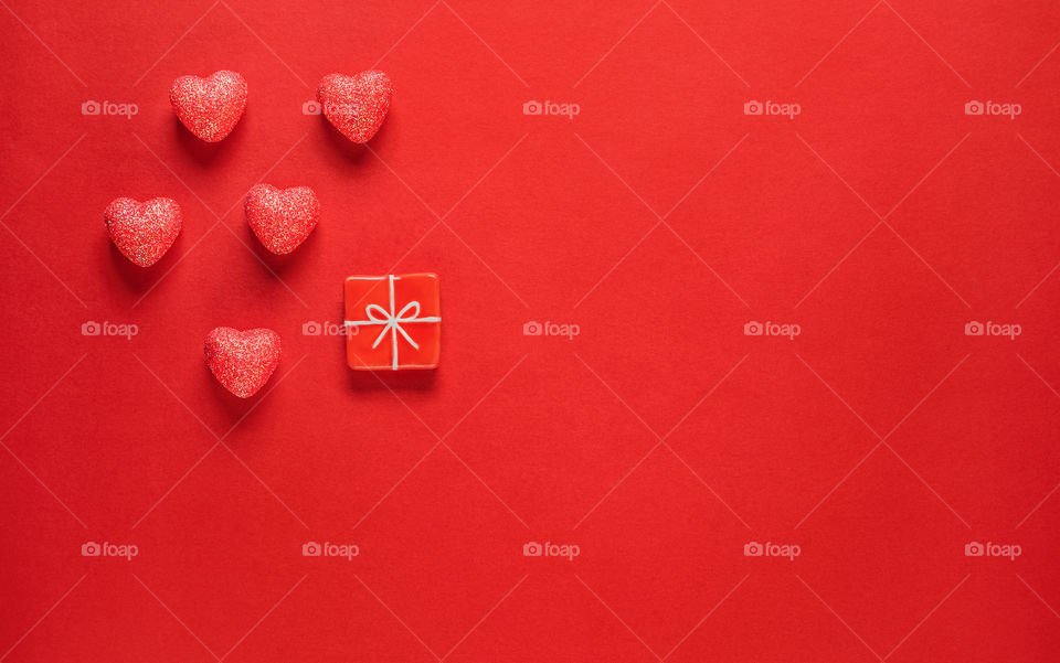 Red hearts on a red background. Valentine's Day. Postcard. Red pepper.