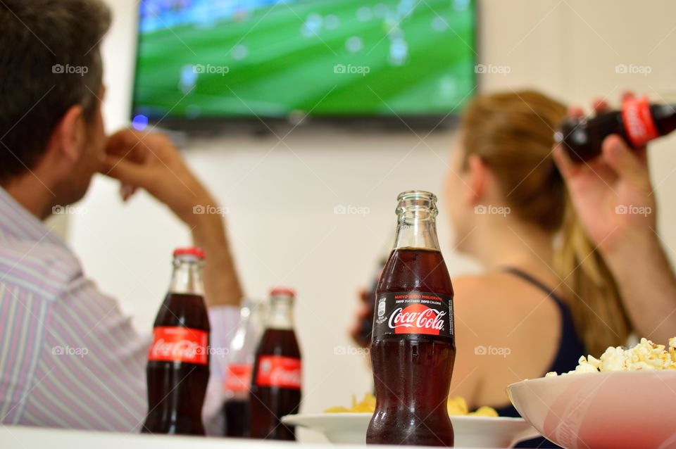 Friends who drink Coca-Cola