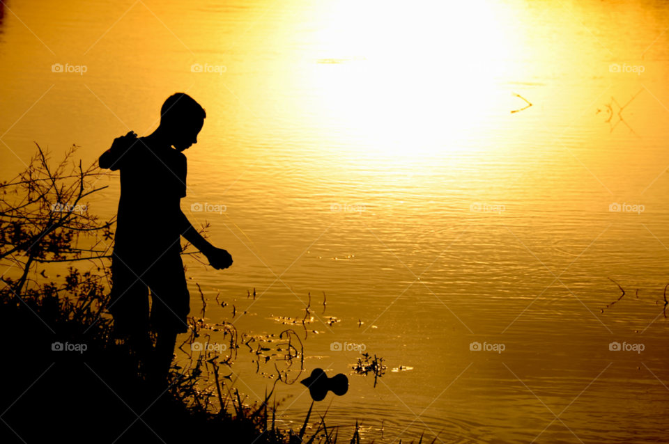 fishing sunset on lake boy fishing boy on lake at sunset by lightanddrawing