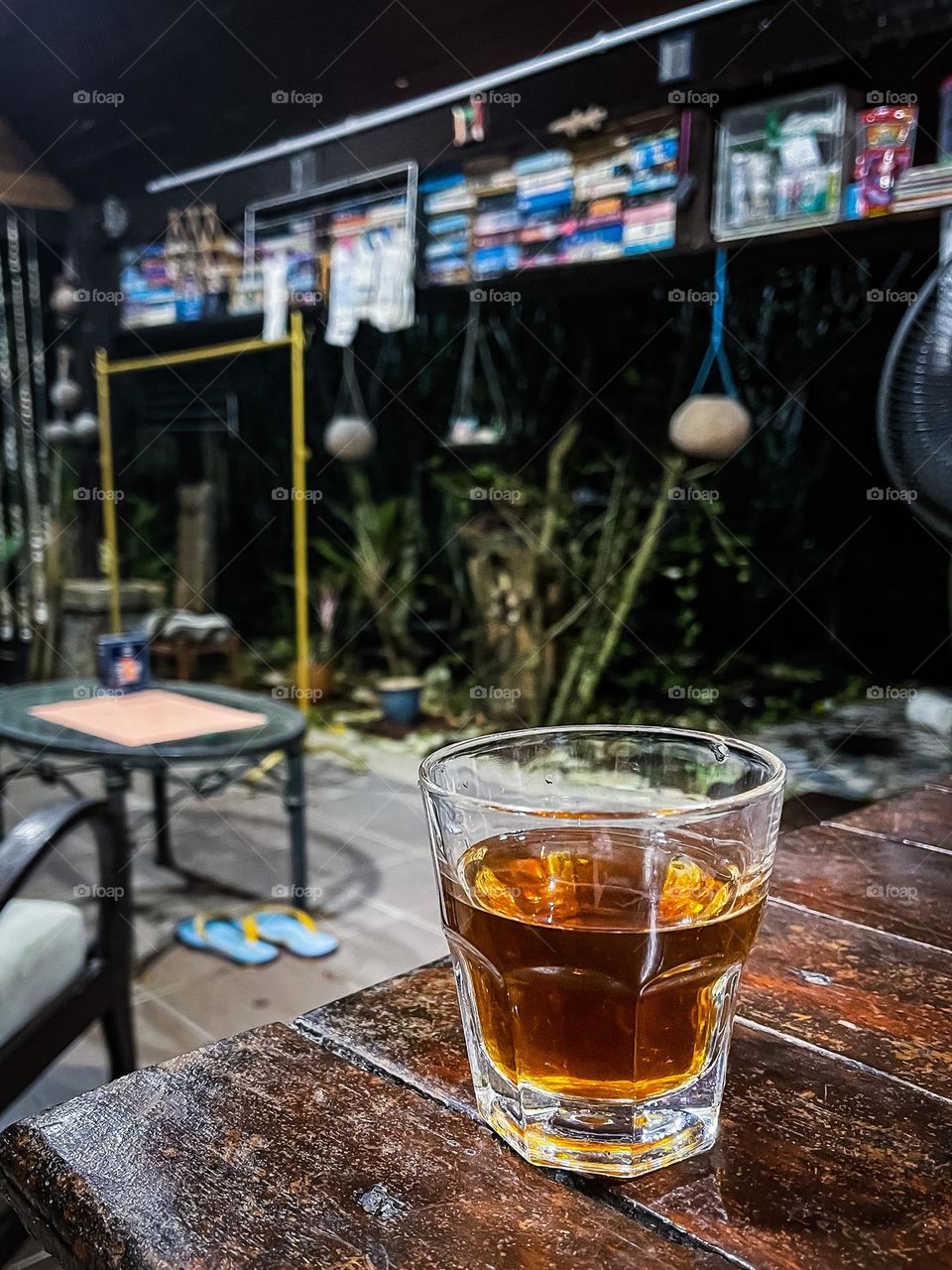 A cup of tea on a wooden table with blurry background 