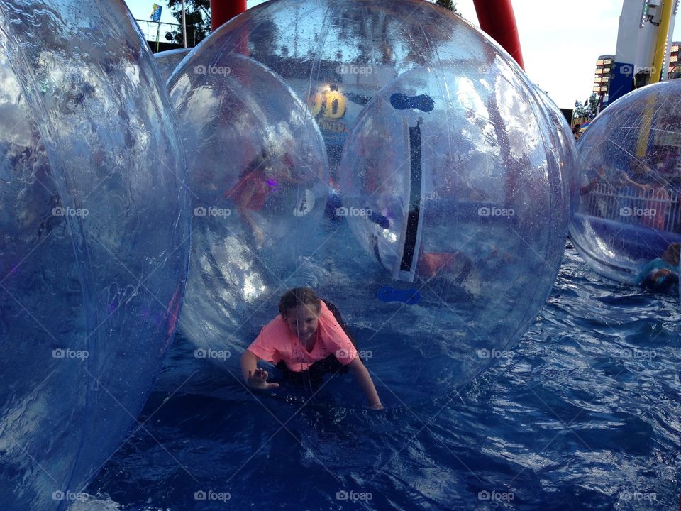 Walk on water amusement ride, little girl in bubble. Walk on water amusement ride, little girl in bubble