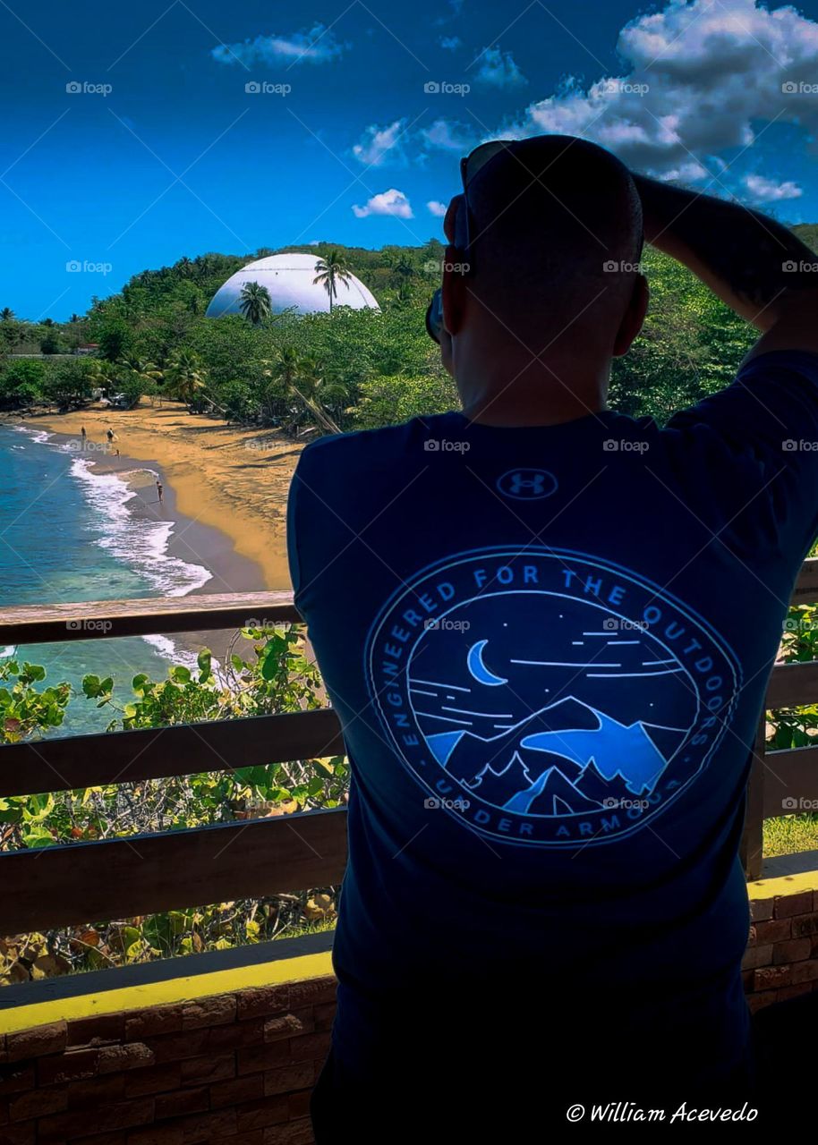 A photo of myself taking picture in Domes Beach in Rincón, Puerto Rico. This places is heaven for surfers from all parts of the world