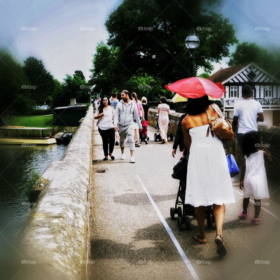 People. People walking across bridge 