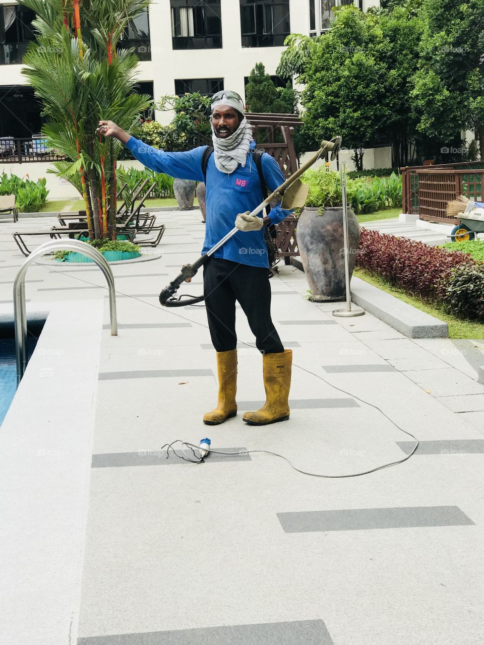 A man in garden cleaning