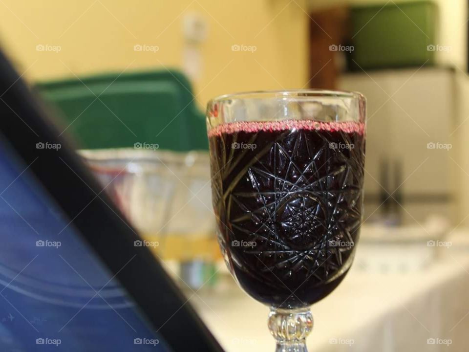 Deep purple grape juice in a crystal glass