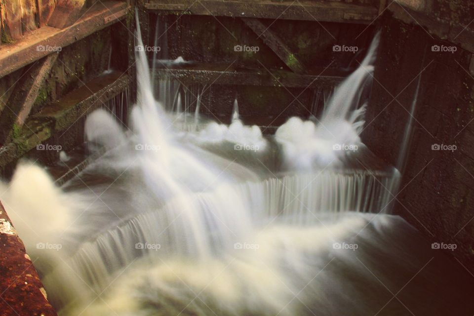 A slow shutter shot of the water coming through the lock gates at Movanagher