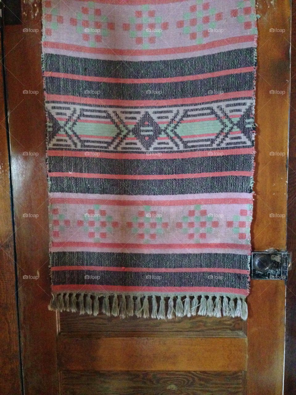 Old tiny door, little patterned rug