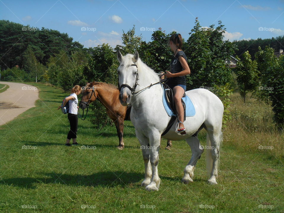 people on a horses pet