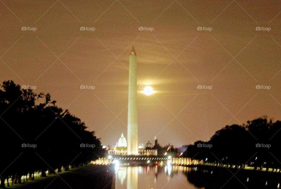 Washington monument standing tall in moon light 