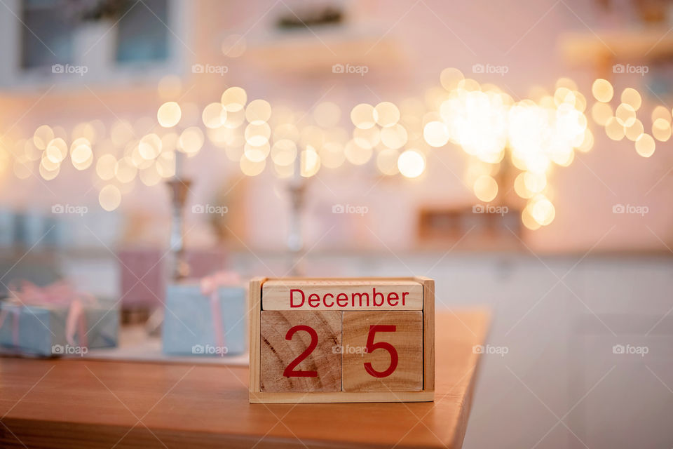 Christmas background with wooden block calendar with the date of December 25