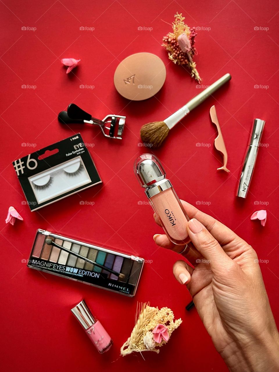 Decorating cosmetic, hand holding the lipgloss, beauty brands.