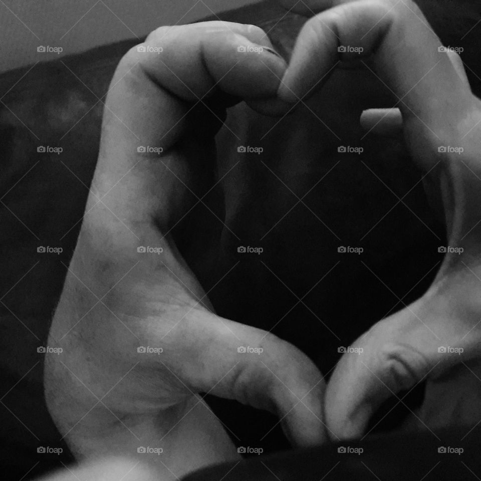 A heart formed with fingers