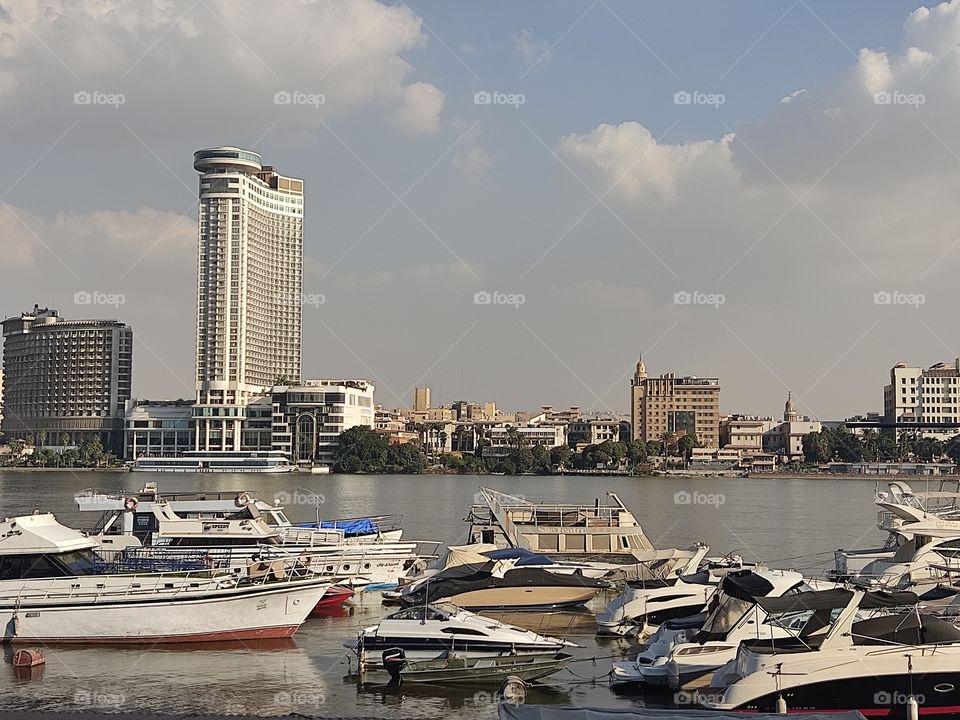 nile river and boats cairo towers and hotels at cloudy morning