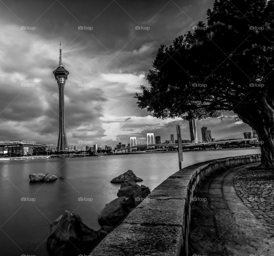 The pathway to the Tower before the Storm about to arrived in a Moody Sunset View from the other side of the Lake.