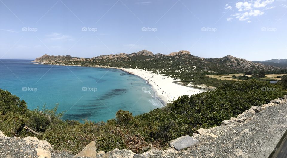 The golden sand and turquoise waters of Corsica.