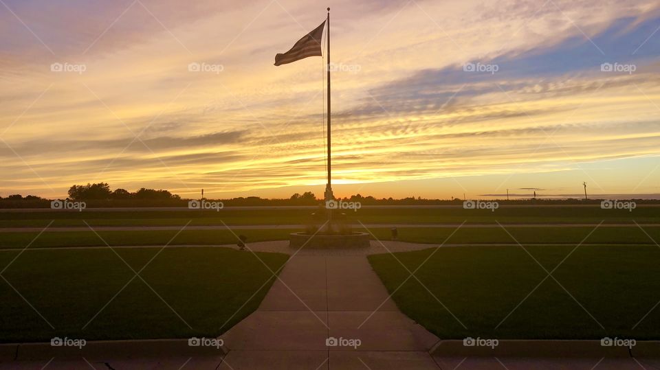 Beautiful sunset with an American flag in the foreground. The symmetry of the photo also adds a nice touch to the composition