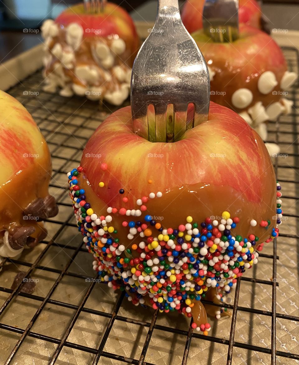 Delicious caramel and sprinkled covered honey crisp apple is a delicious afternoon snack!! 