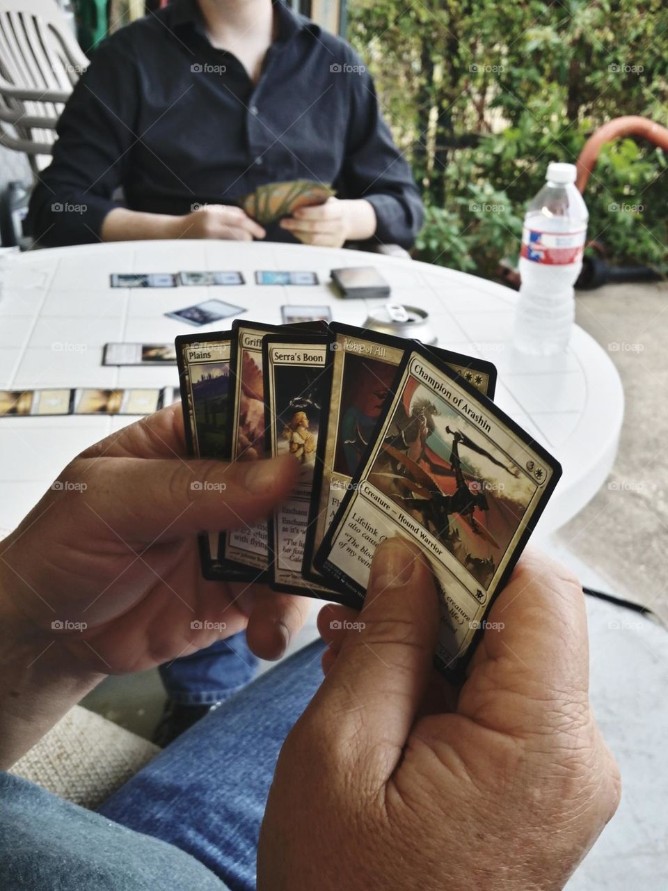 Father & Son Playing Magic Card Game Outside