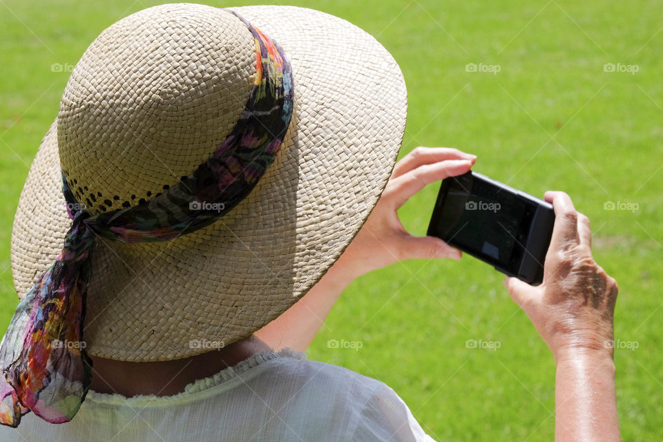 Phone. Camera phoneTourist taking a picture with a smartphone cell phone mobile phone camera 