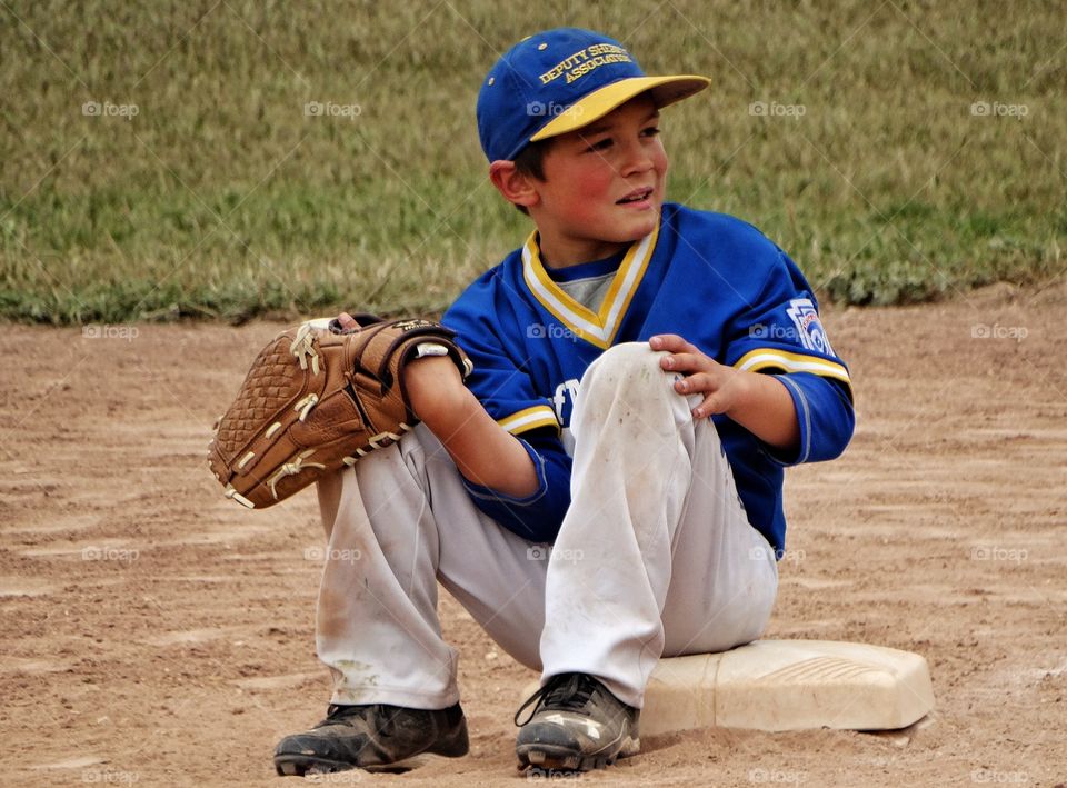 Young Baseball Player. Young Boy Playing American Little League Baseball
