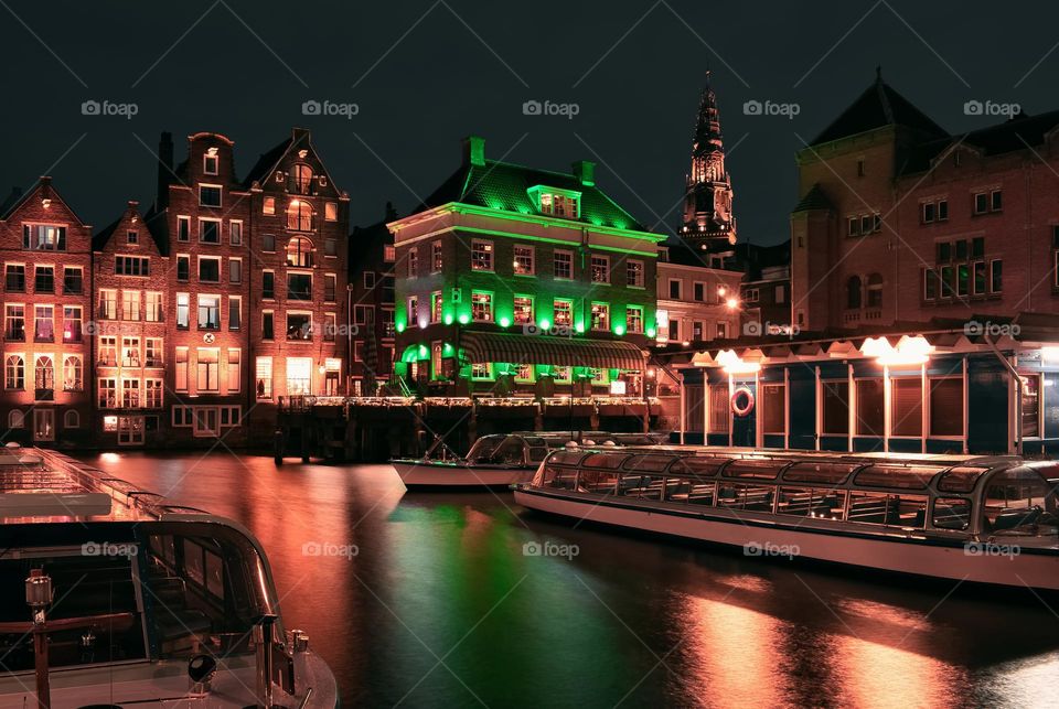 Night scene with architecture under green light at Amsterdam, Netherlands