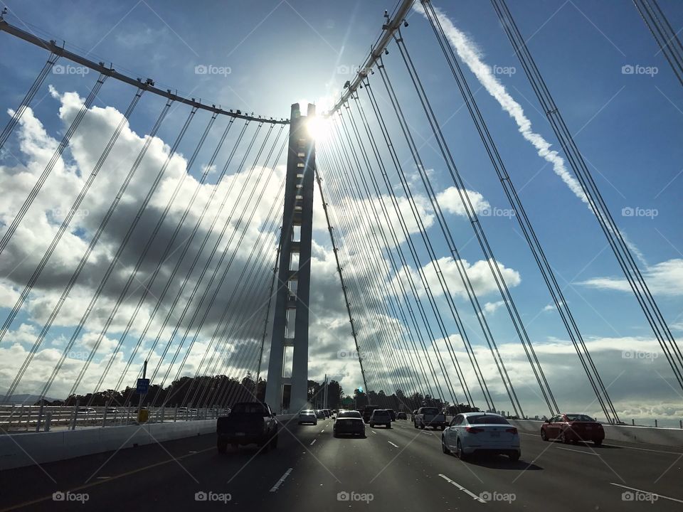 Bay bridge silhouette by the sun