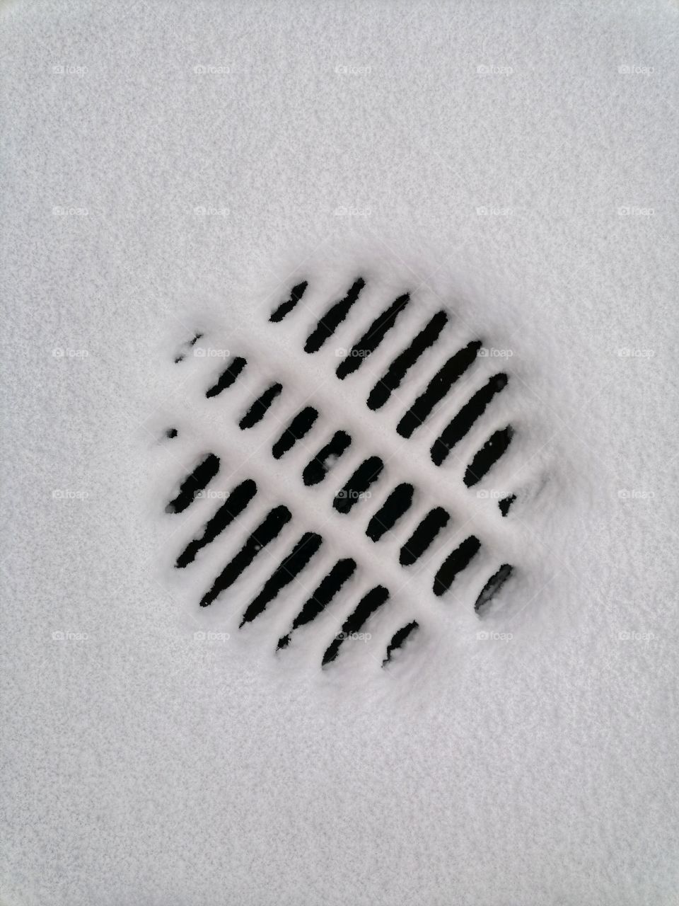 Winter arrived in Finnish Lapland in October. Steam from the manhole cover melts the snow