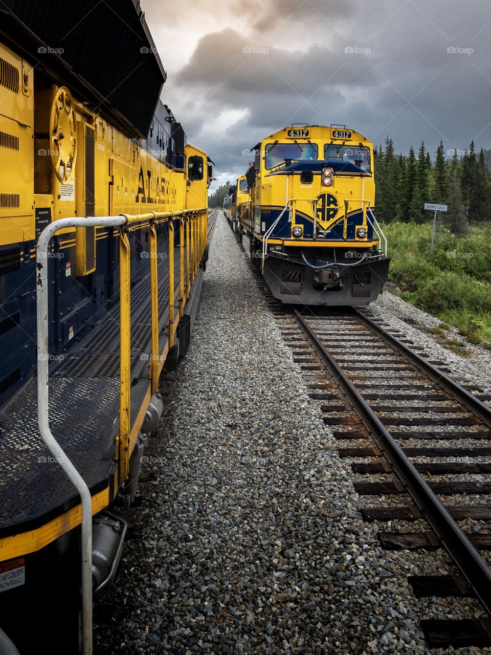 Two locomotives pass each other on the Alaska Railroad 