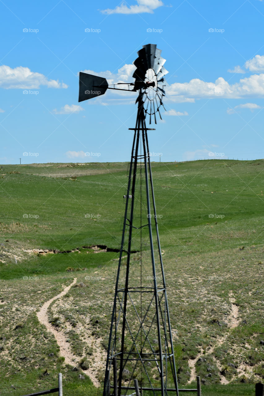 windmill in an open field in nebraska