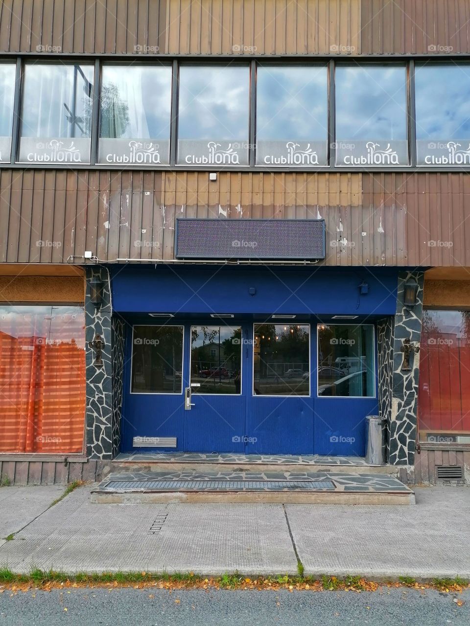 An old dilapidated building in the middle of a town that used to be a restaurant and night club. No one walks through these doors anymore. Sad.
