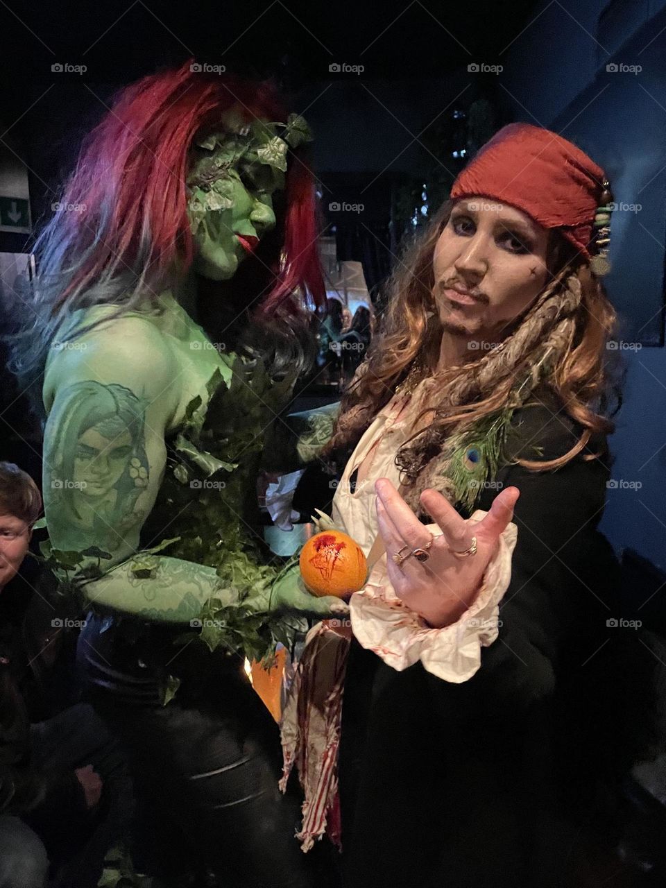 Poison ivy and capitain Jack Sparrow at halloween carnivail in Helsinki