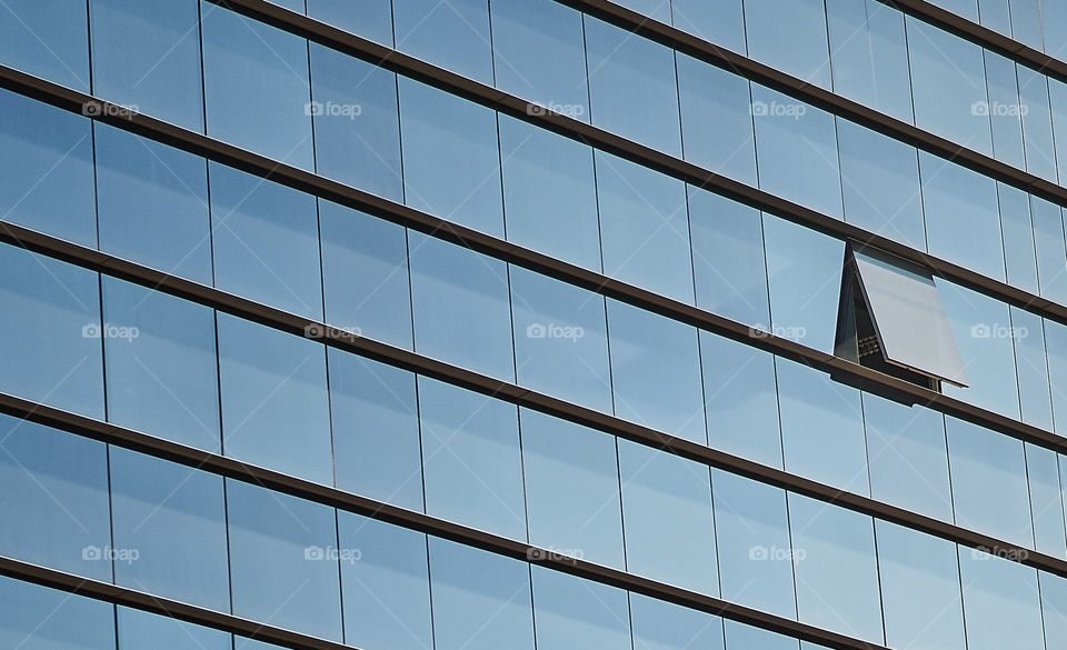 Close-up of building with open window glass